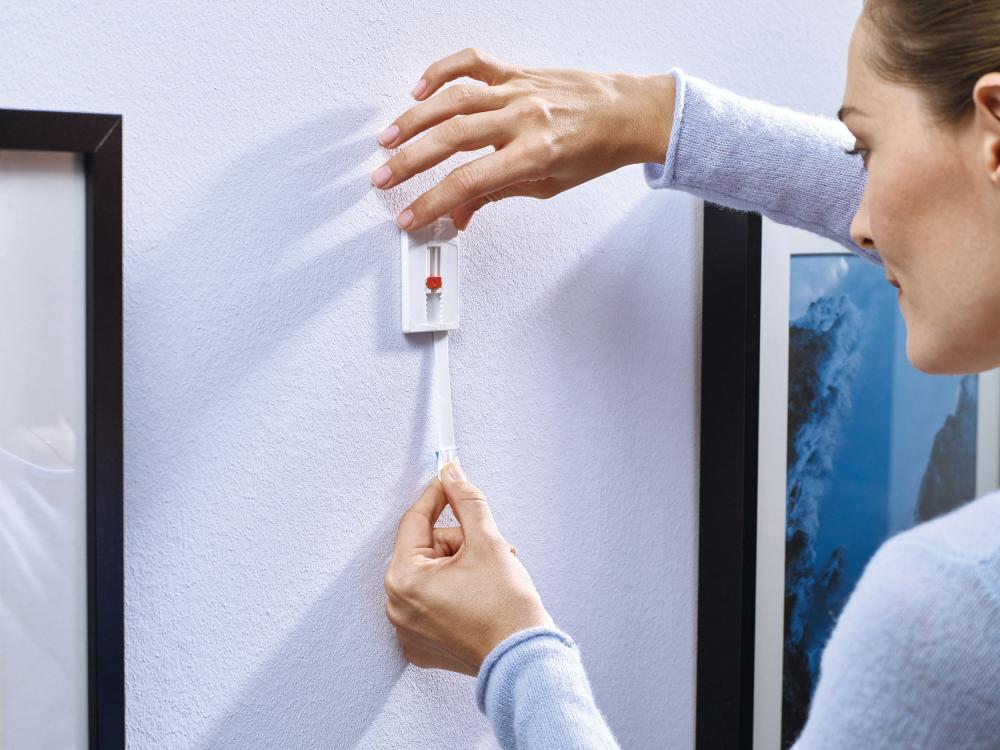 Tesa - Clou autocollant réglable pour tous types de murs (max 2x2kg)